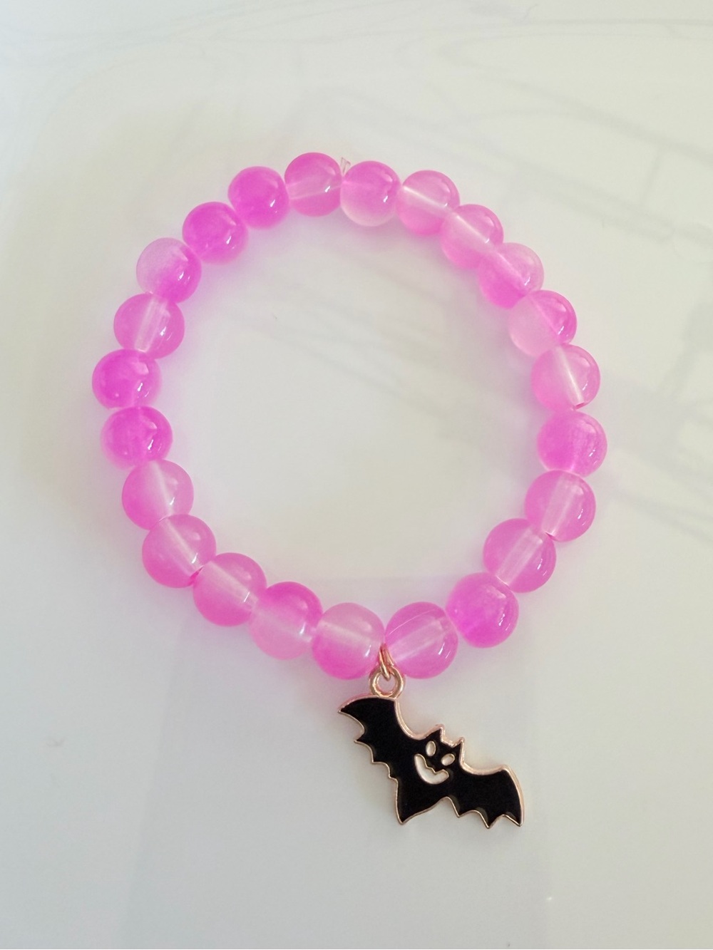Pink Beaded Bracelet with Bat Charm